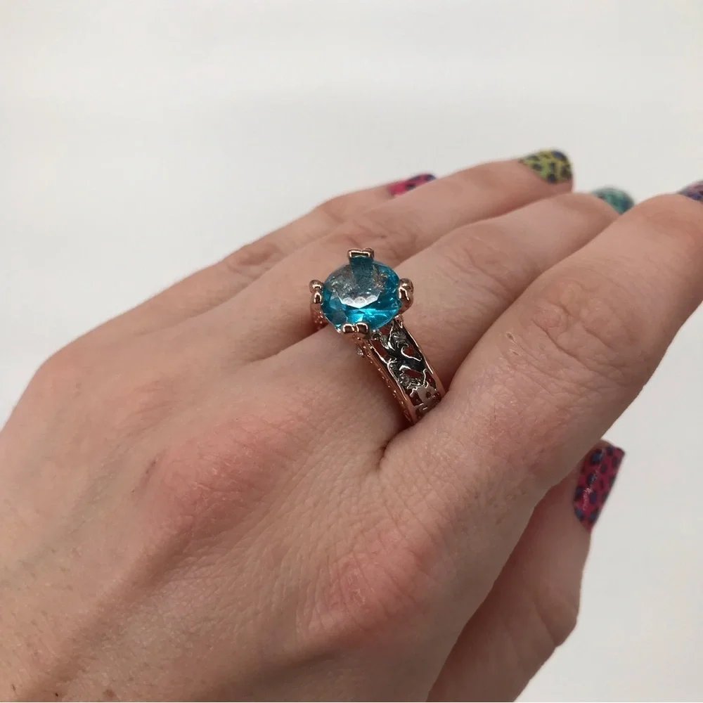 Mixed Metal Solitaire Ring with Blue Stone